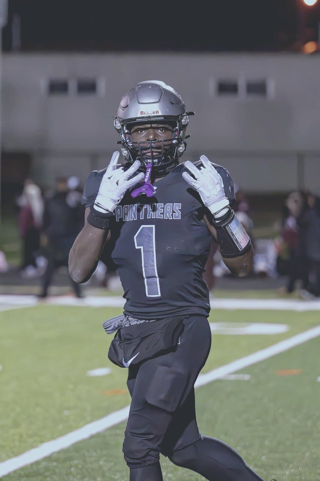 Panthers #1 looks into the camera under stadium lights