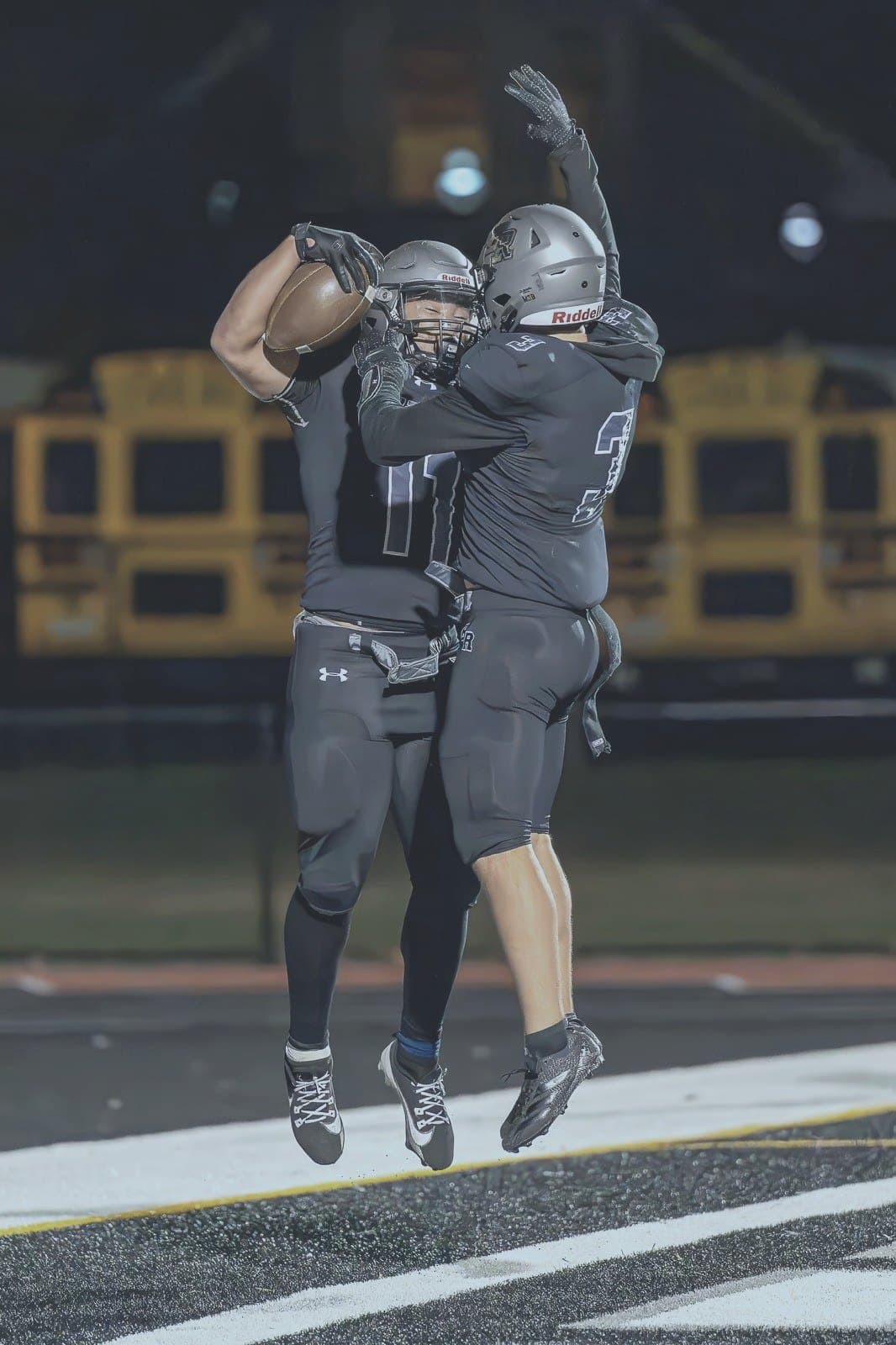 Two Panthers players celebrate a big play