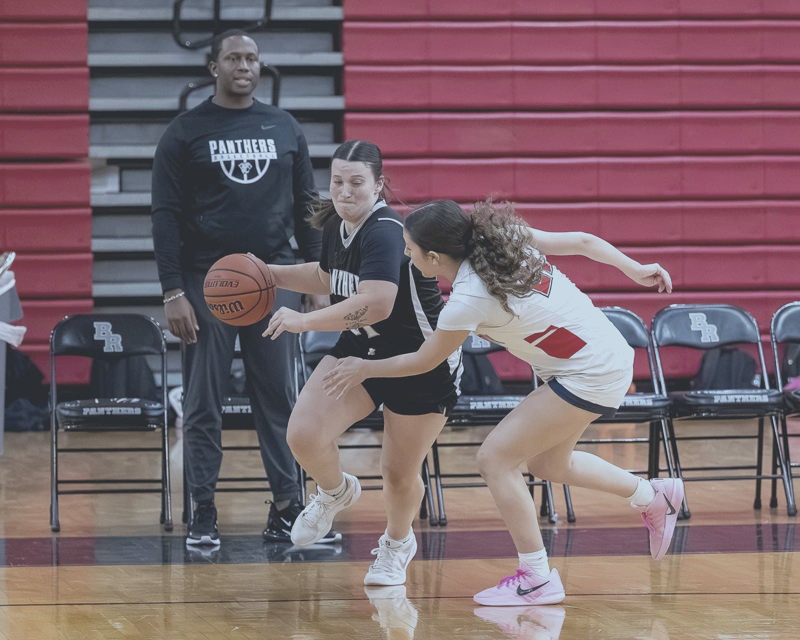 Panthers guard drives the ball against pressure defense