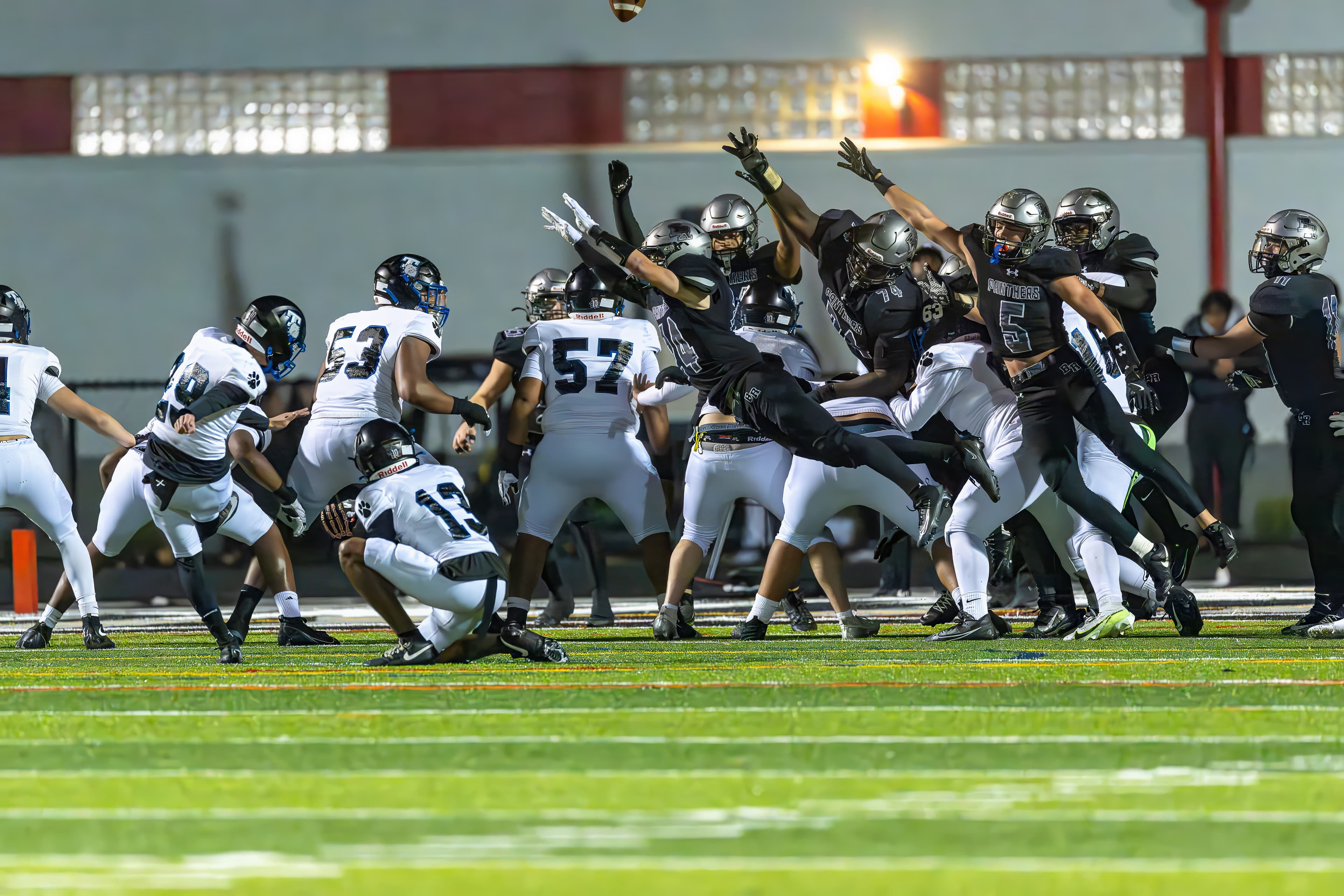 Running back breaks a tackle at the second level