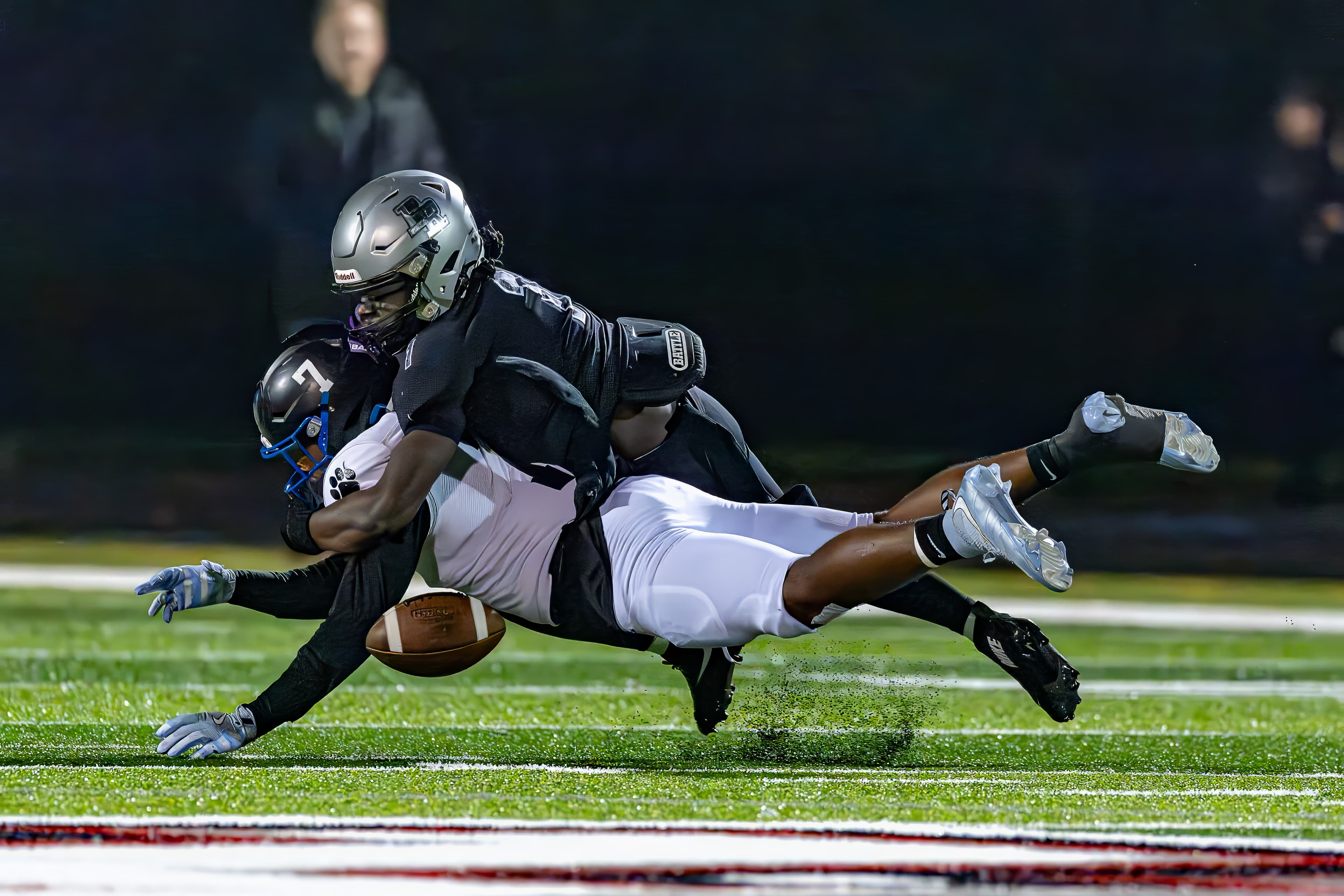 Wide receiver goes up for a contested ball