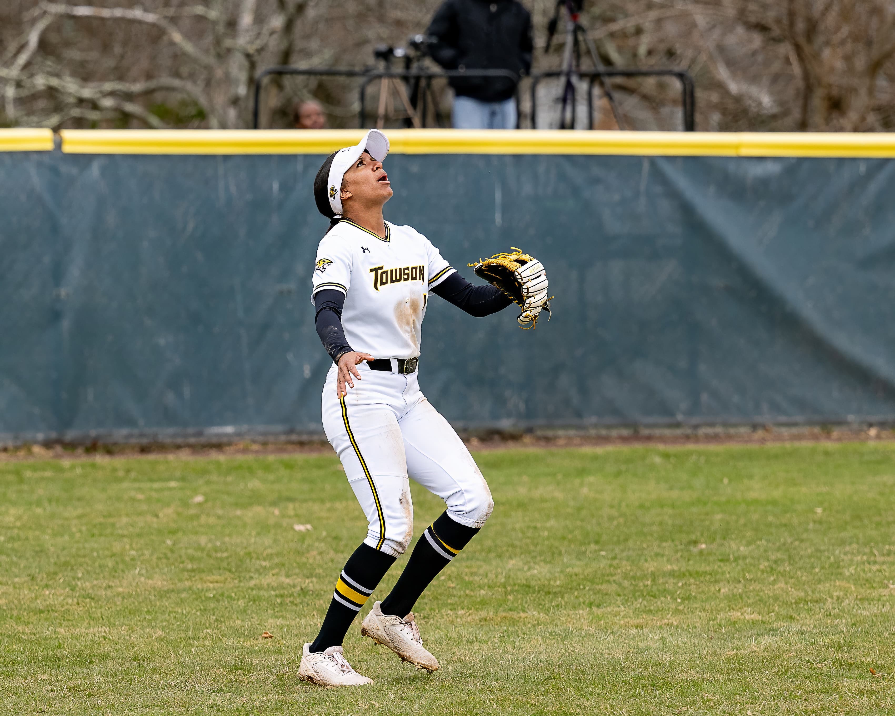 Pitcher holds the runner and checks the sign