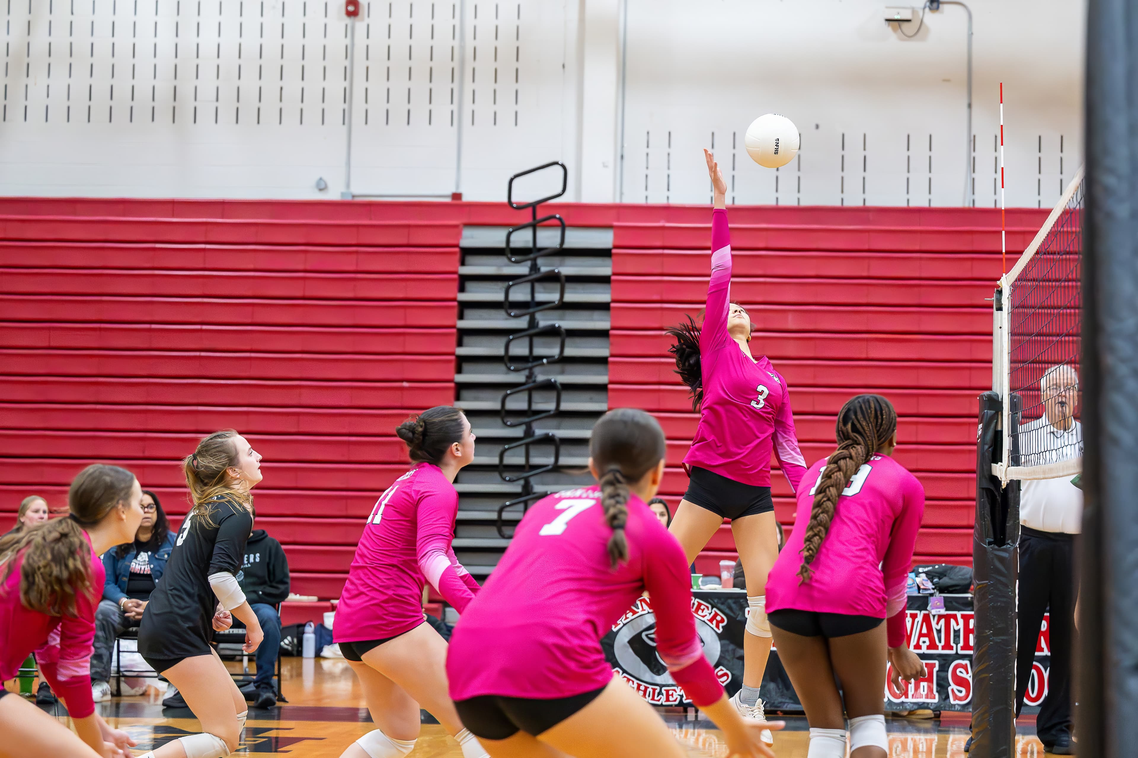 Libero digs a low ball in serve receive
